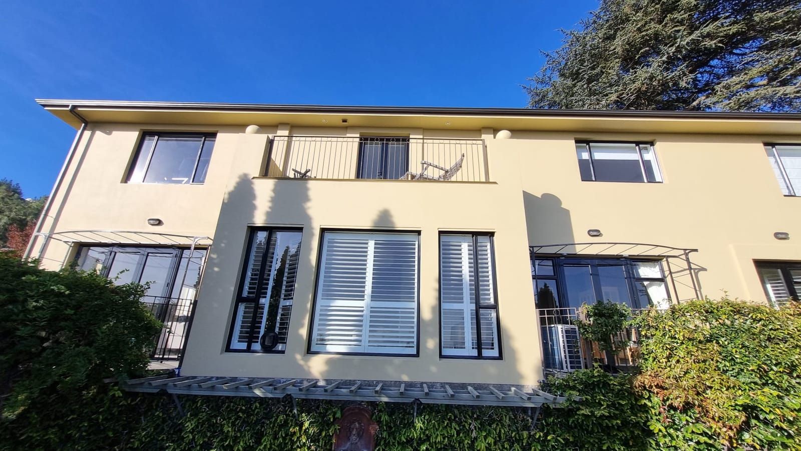 Two-storey cream plastered home repaint